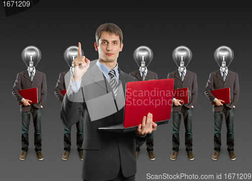 Image of lamp head businesspeople with laptop