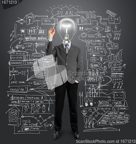 Image of lamp head businessman writing something