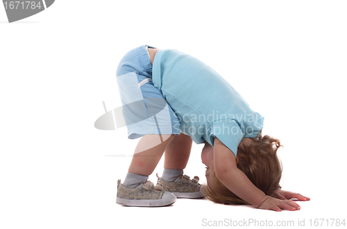 Image of Little boy upside-down