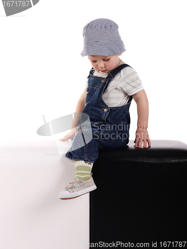 Image of Little boy sitting on the cubes