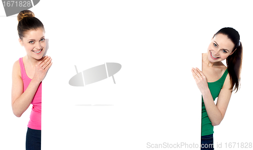 Image of Beautiful women holding a blank whiteboard