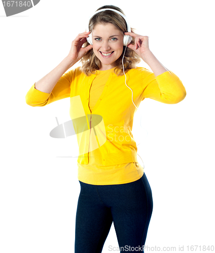 Image of Gorgeous teenager enjoying music