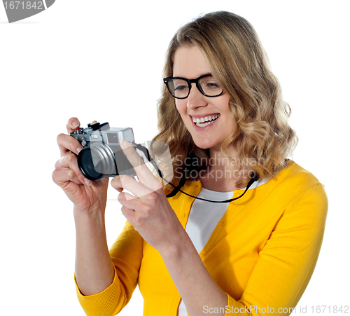 Image of Female photographer with a camera