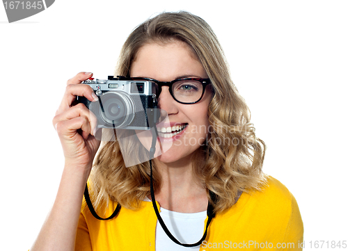 Image of Beautiful young girl with camera