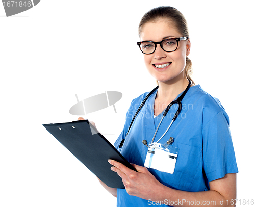Image of Friendly female doctor with a clipboard