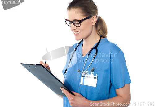 Image of Female doctor holding a clipboard