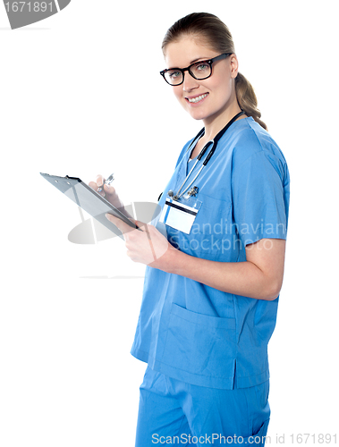 Image of Female doctor holding a clipboard