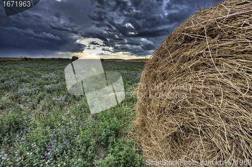 Image of Hay Bale and Prairie Storm
