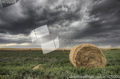 Image of Hay Bale and Prairie Storm