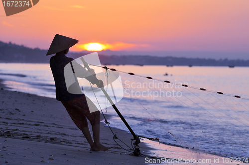Image of Silhouette of a fisherman