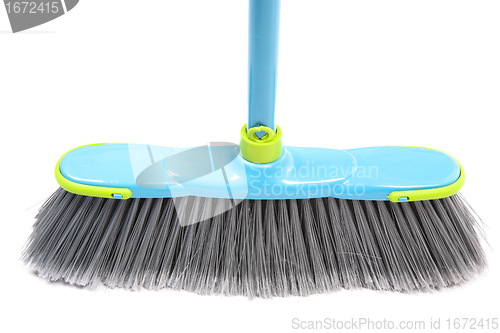 Image of Brush for a floor with the blue handle 