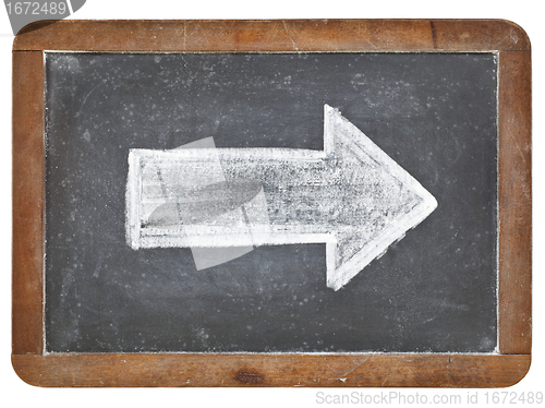 Image of white arrow on blackboard