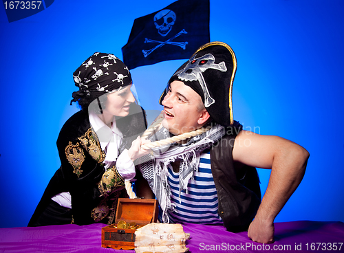 Image of two fighting pirates on blue
