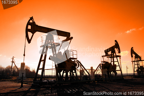 Image of working oil pumps silhouette
