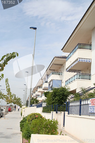 Image of Apartment-buildings along a street next to the sea