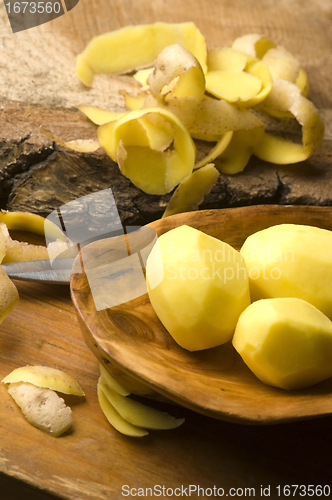 Image of Raw potatoes and potato peels