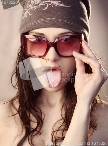 Image of Girl shows her tongue