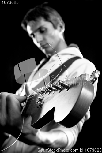 Image of male with guitar