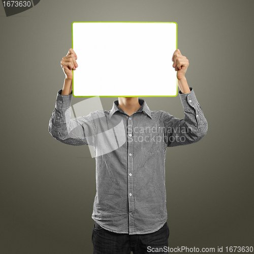 Image of male with write board in his hands