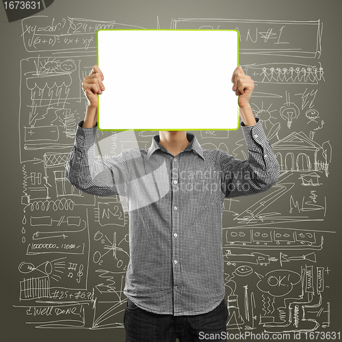 Image of male with write board in his hands