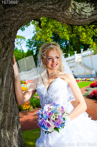 Image of beautiful bride in a summer  park