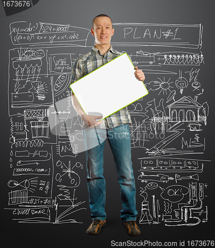 Image of asian male with write board in his hands