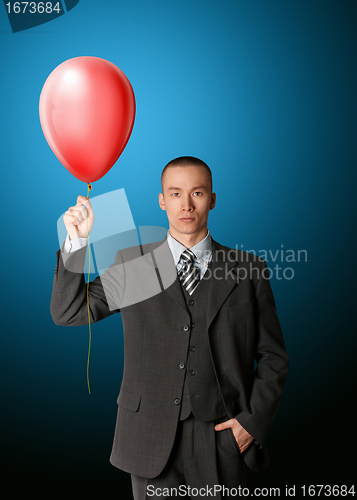 Image of businessman in suit with the balloon