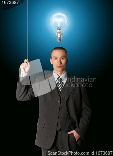 Image of business man turn on the light