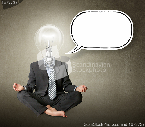 Image of businessman in lotus pose and lamp-head with thought bubble