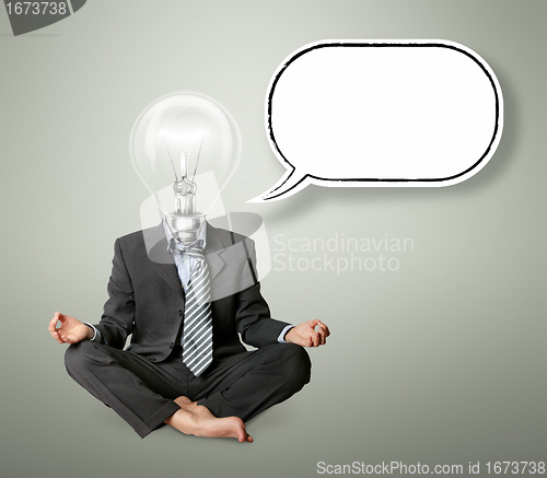 Image of businessman in lotus pose and lamp-head with thought bubble