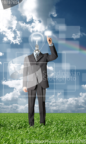 Image of full length businessman with lamp-head push the button outdoors