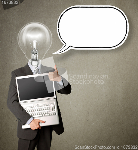 Image of businessman with lamp-head with open laptop and bubble