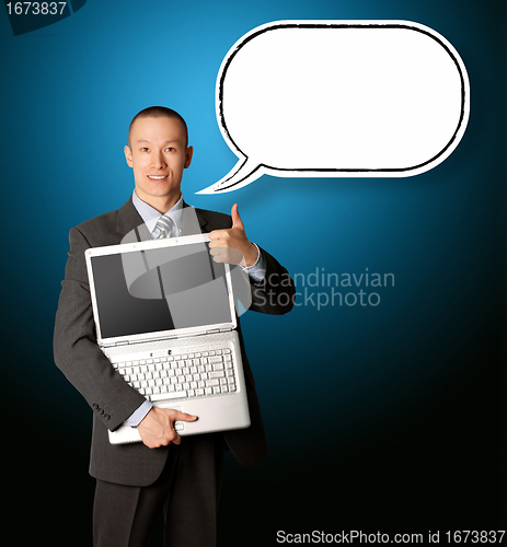 Image of businessman with laptop and thought bubble