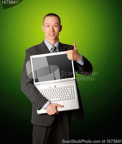 Image of businessman with open laptop shows welldone