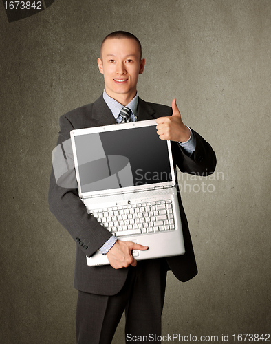 Image of businessman with open laptop shows welldone