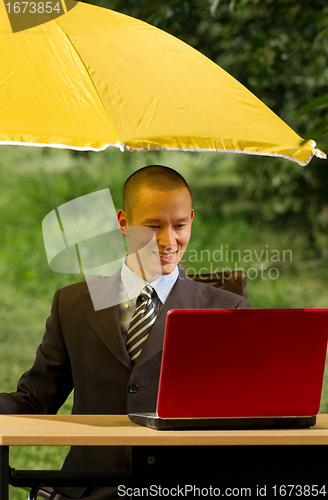 Image of businessman with umbrella