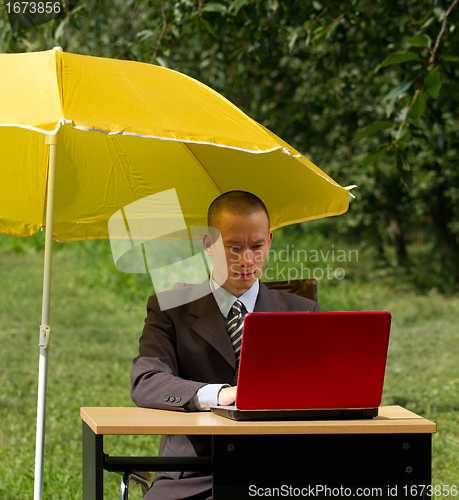 Image of businessman with umbrella