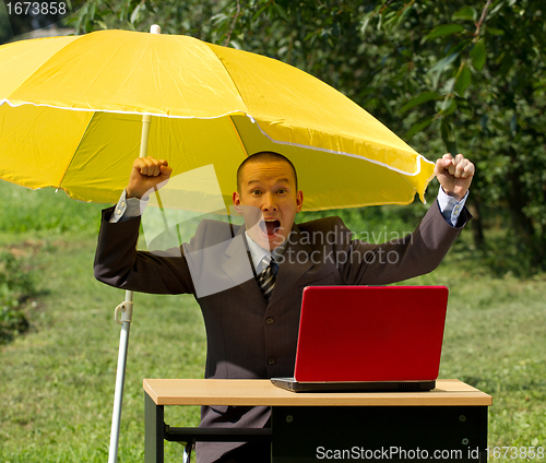 Image of businessman with umbrella