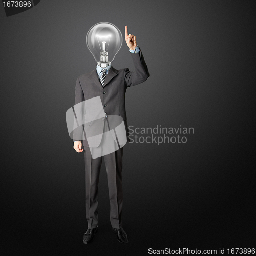 Image of full length businessman with lamp-head push the button