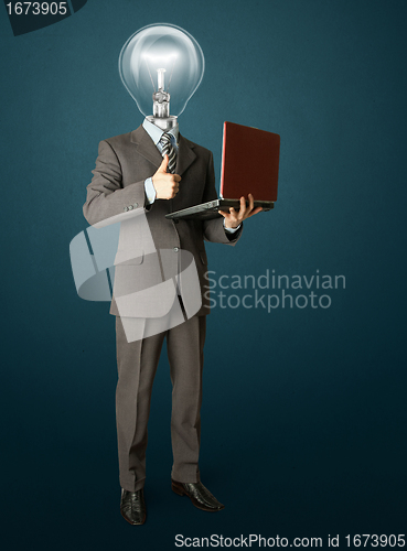 Image of Full length portrait of lamp-head businessman with laptop