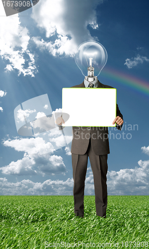 Image of businessman with lamp-head holding blank card outdoors