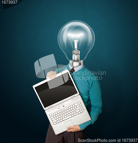 Image of Male with lamp-head in blue with laptop