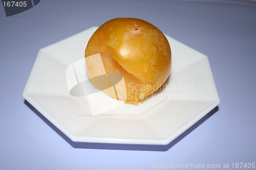 Image of Yellow plum on small plate