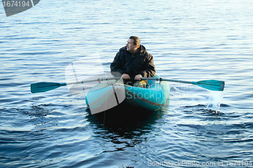 Image of Fisherman in Rubber Boat