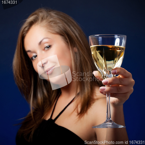 Image of beautiful girl with glass of wine