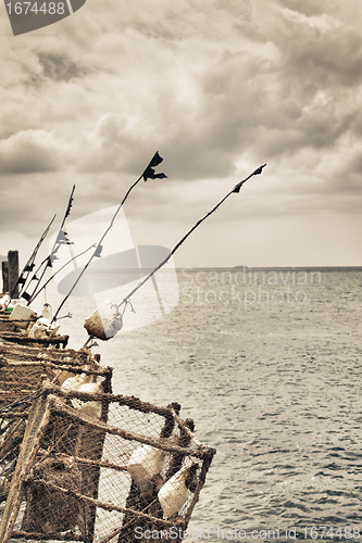 Image of Fishing Rods on a Pier