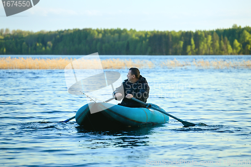 Image of Fisherman in Rubber Boat