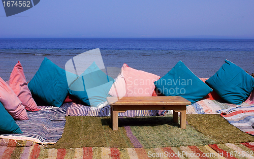 Image of Blanket and table on beach