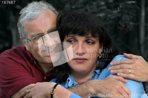 Image of Mature couple embrace