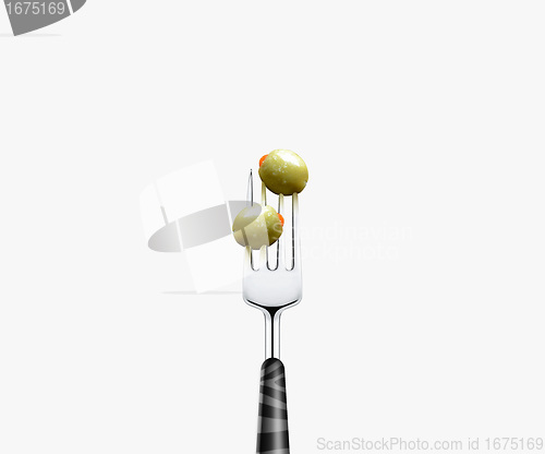 Image of olive pierced by fork,  isolated on white background 